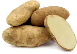 Fresh Idaho potatoes from ZabhiaNow, loose and unwashed, with smooth brown skin and round shape, ready for cooking or baking.