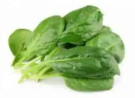Fresh spinach in a ZabhiaNow cello bag, ready for purchase, showcasing vibrant green leafy vegetables.