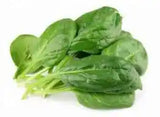 Fresh spinach in a ZabhiaNow cello bag, ready for purchase, showcasing vibrant green leafy vegetables.