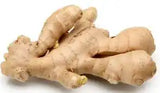Fresh ginger root from ZabhiaNow, showcasing its knobby, earthy appearance with a light brown skin and vibrant yellow interior.