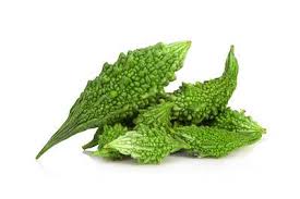 Fresh green karela (bitter melon) from ZabhiaNow, showcasing its textured, bumpy surface on a white background.