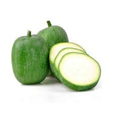 Fresh winter melon from ZabhiaNow, showing a whole green winter melon with smooth skin and a round shape on a white background.